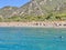 Birch, clear sea and mountains on the horizon. An ideal place for a seaside holiday. In the distance, a Mediterranean beach, view