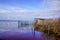 Bird duck hunting trap in the morning at wild sunrise over a calm rural lake pond