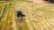 Bird eye of Hay rake tractor turning the hay