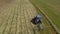 Bird eye of Hay rake tractor turning the hay