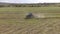 Bird eye of Hay rake tractor turning the hay