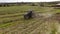 Bird eye of Hay rake tractor turning the hay