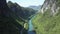 Bird eye view calm river and empty highway in green canyon