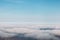 Bird eye view at clouds in blue sky top view from drone from airplane window