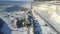 Bird eye view excavator operates at wagons on railway in pit