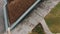 Bird eye view of modern architect building roof covered in soil and grass