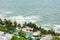 Bird eye view of white sand beach, coconut palm trees, hotels, resorts and tropical sea surf on Koh Chang island in Thailand