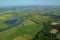 Bird flight over meandering river