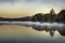 Bird flying over foggy Adirondack Lake