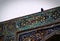 A bird on a historic ancient colorful islam bulding wall, Bukhara, Uzbekistan
