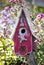 Bird House in Flowers Garden