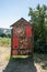 Bird and insect hotel made from tree trunks, bricks and other items