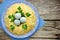 Bird nest Easter salad decorated with boiled egg yolks and cheese