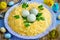 Bird nest Easter salad decorated with boiled egg yolks and cheese