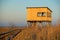 Bird observation cabin and wooden path through the reeds at sunrise lake Zuvintas Lithuania birdwatching, wildlife, nature reserve