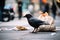 a bird pecking at a fast-food bag, surrounded by other litter in the city