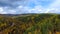 A bird\'s-eye aerial flight over the road autumn forest. Russia Buryatia