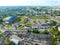 A bird\\\'s-eye view of the city. Flying a drone over the city during the day. View of a large sports complex