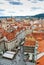 Bird`s eye view of the city of Prague with overcast sky seen from the Old Town Hall Tower, also known as the Clock Tower