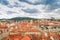 Bird`s eye view of the city of Prague with overcast sky seen from the Old Town Hall Tower, also known as the Clock Tower