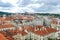 Bird`s eye view of the city of Prague with overcast sky seen from the Old Town Hall Tower, also known as the Clock Tower