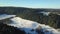 From a bird \'s - eye view . Clip. Winter morning with bright sky, huge Christmas trees and snow
