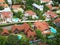 Bird\'s eye view of high class landed property estate with large beautiful houses and many private swimming pools