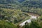 Bird`s eye view of mighty forest on rainy day and river. Europian mixed wood.