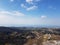 Bird's eye view of a mountainous landscape with a vast variety of trees and craggy rocks