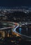 Bird`s eye view at night of the urban expressway circular route crossing in zig-zag in Fukuoka.