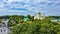 Bird`s eye view of an old church in a village on a beautiful summer day. Picture from above an ancient church during day time