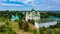 Bird`s eye view of an old church in a village on a beautiful summer day. Picture from above an ancient church during day time