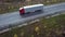 Bird's-eye view of semi-trailer with trailer driving alone an interstate highway