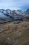 Bird`s eye view of a small mountain village in a valley with impressive mountains in the background in Silvretta Pass