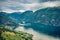 From the bird`s-eye view of Sognefjorden fjord. Great summer scene with Aurlandsvangen village, Norway. Traveling concept backgro