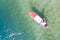 Bird`s eye view to girl on SUP surf board on turquoise clean lake water