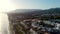 Bird\'s-eye view of an urban landscape meeting the azure sea, under the warm glow of sunset. Costa Del Sol, Marbella
