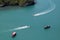 A bird\\\'s-eye view of various tour boats sailing in the sea, the white waves look beautiful