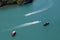 A bird\\\'s-eye view of various tour boats sailing in the sea, the white waves look beautiful