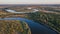 Bird`s view landscape shot of curved river during autumn