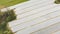 Bird`s view of white covers over plantation sheltering young vegetable sorts from freezing on the farm near Zagreb city