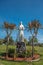 Bird on top of statue of founder, Calvary Cemetery. Santa Barbara, CA, USA