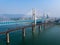 Bird view of Old and New Baishatuo Yangtze River Railway Bridge under blue sky