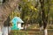 Birdhouse on a background of blurry autumn forest