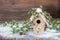 Birdhouse and christmas tree brunch decoration