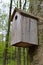 Birdhouse on a high tree in the forest