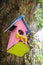 Birdhouse pink color in garden