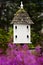 Birdhouse and Pink Flowers