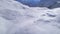 Birds eye descending view group of hikers on Himalayas trek way to frozen Tilicho lake destination. Annapurna circuit