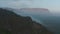 Birds eye drone view over misty foggy countryside in Iceland. Breathtaking foggy panorama of desolate greenland with